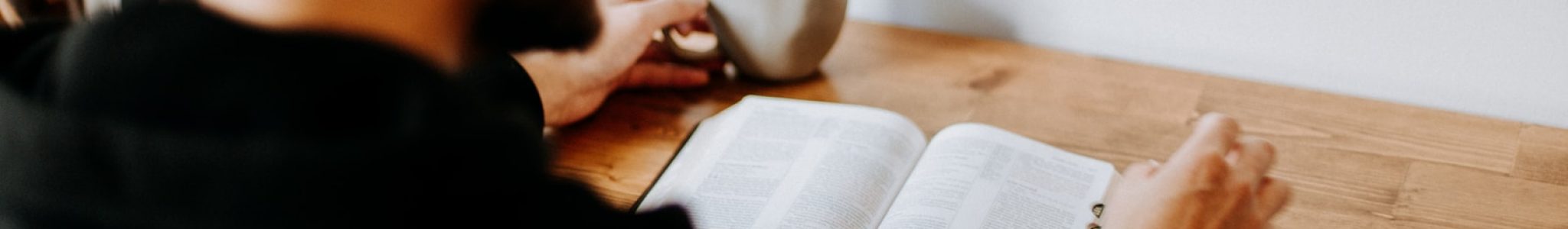Photo by Priscilla Du Preez man in black long sleeve shirt writing on white paper